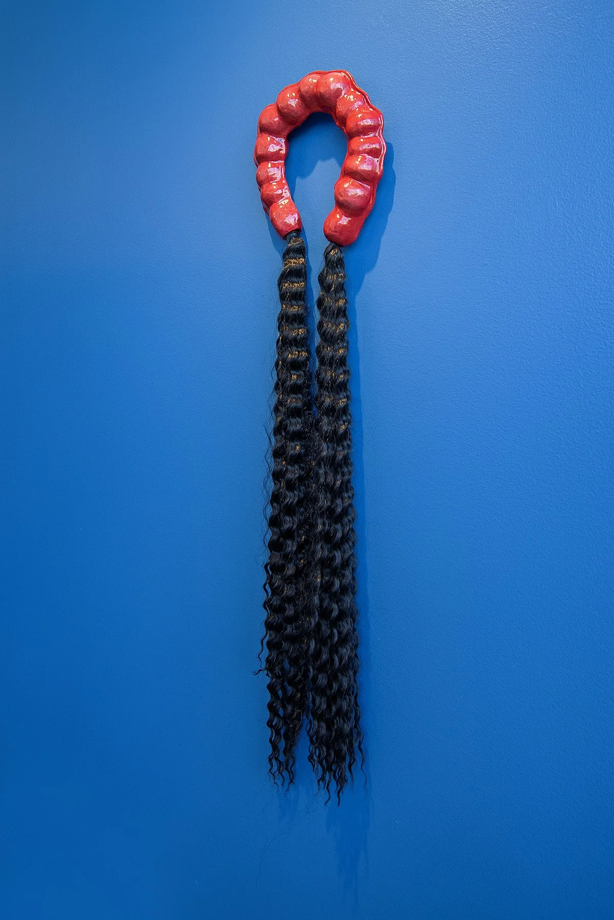   Tug of War  (2025) Intel Lastierre synthetic hair, air dry porcelain and clay size variable 