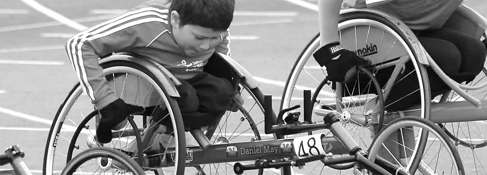 kid in racing chair BW.jpg