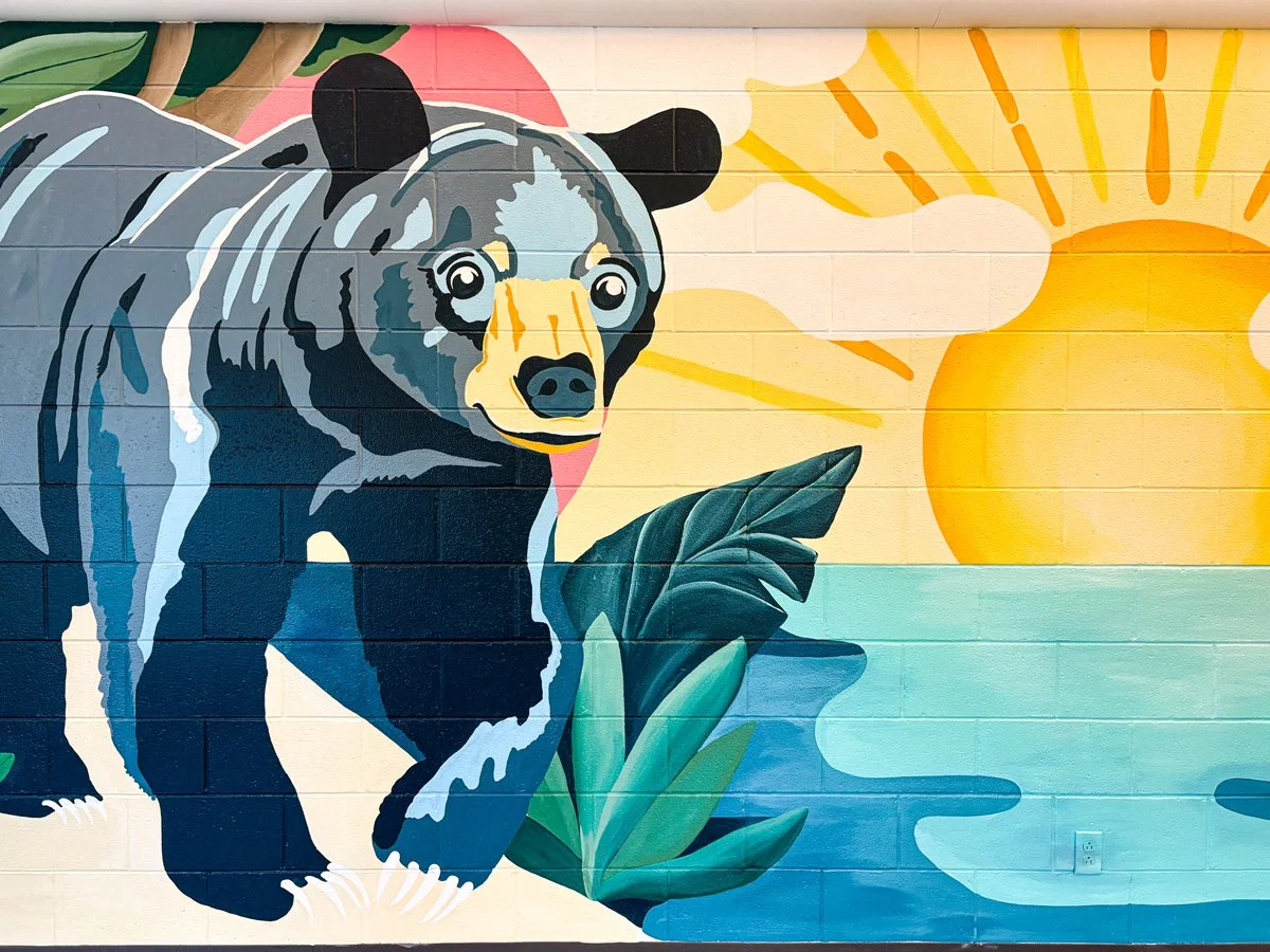 Butler Elementary mural of a florida black bear and coastal dune lake created by Santa Rosa Beach muralist Sarah Page Art