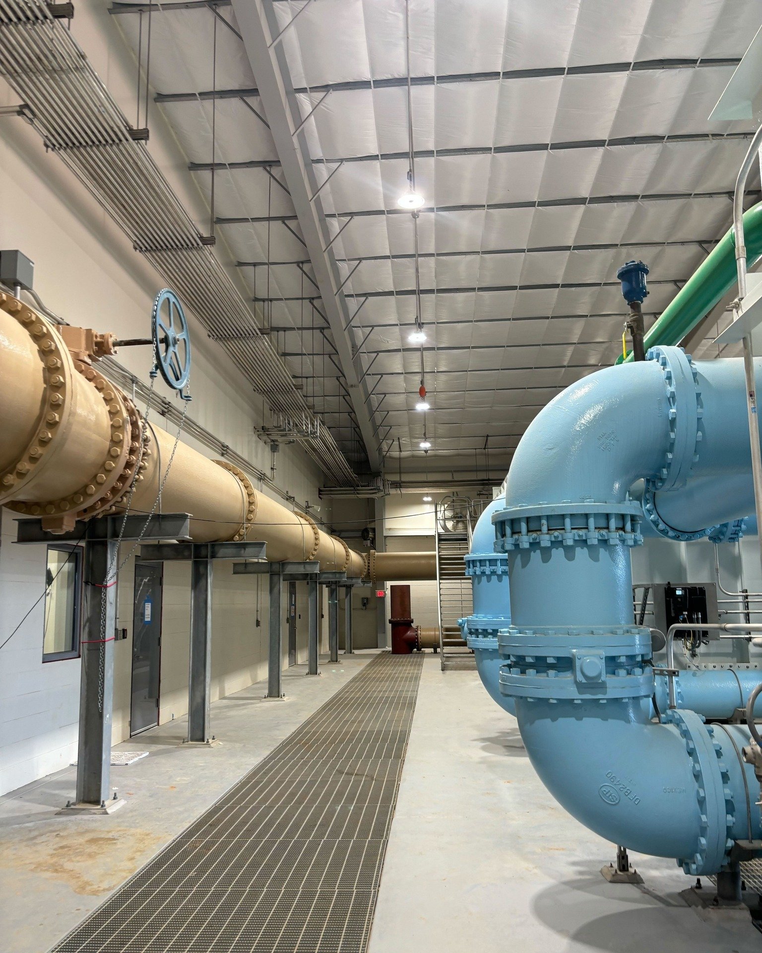 What do the colors of these pipes mean?

In our filtration building, blue pipes carry water that has undergone the last stage of the water treatment process. Brown pipes carry groundwater into the facility, and green pipes transport the air, which is