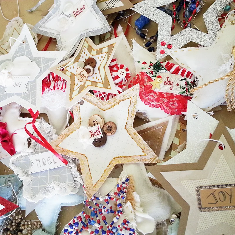 Pretty star ornaments made from paper. fabric and beads given to a local nursing home.