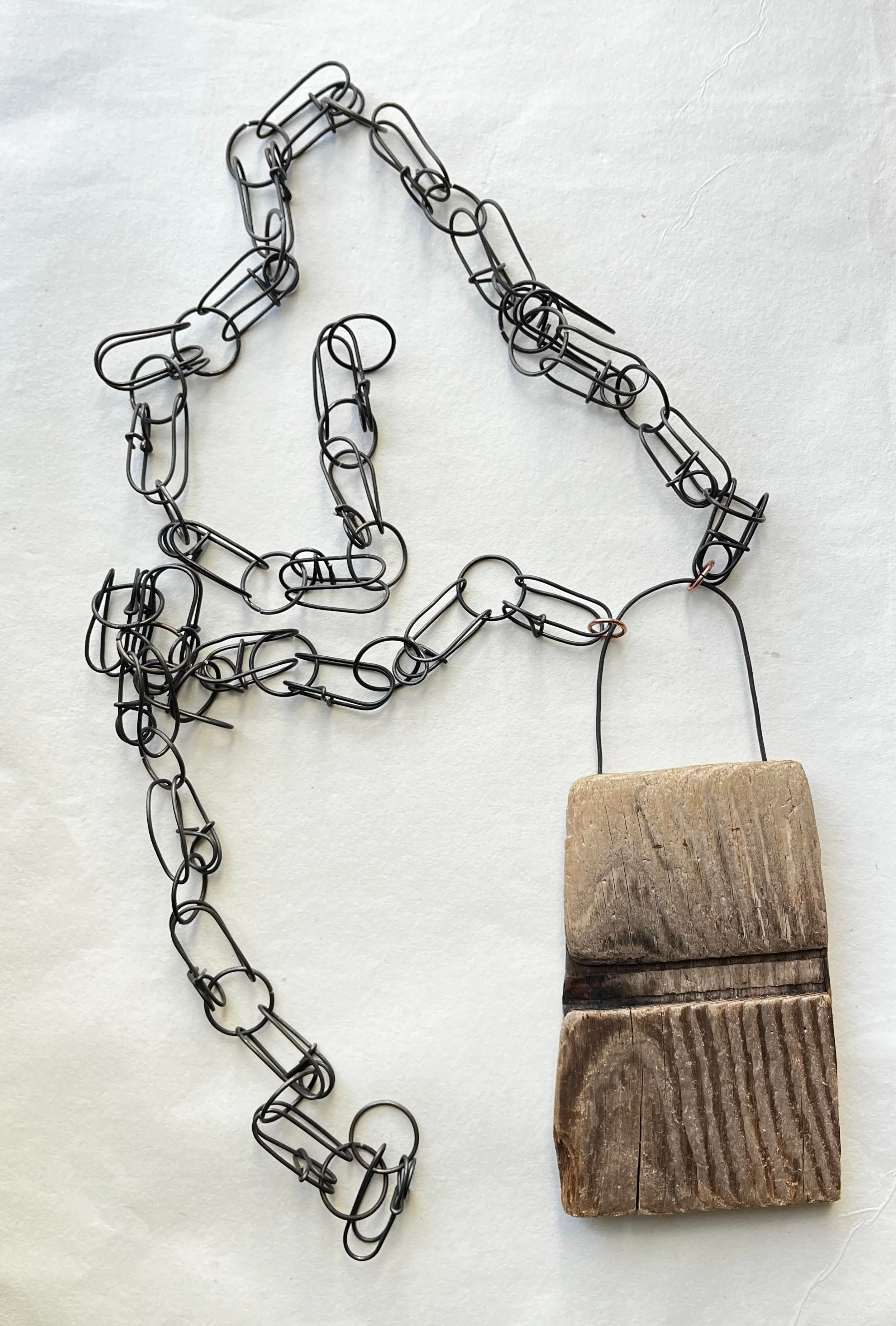 necklace constructed out of steel wire and wood