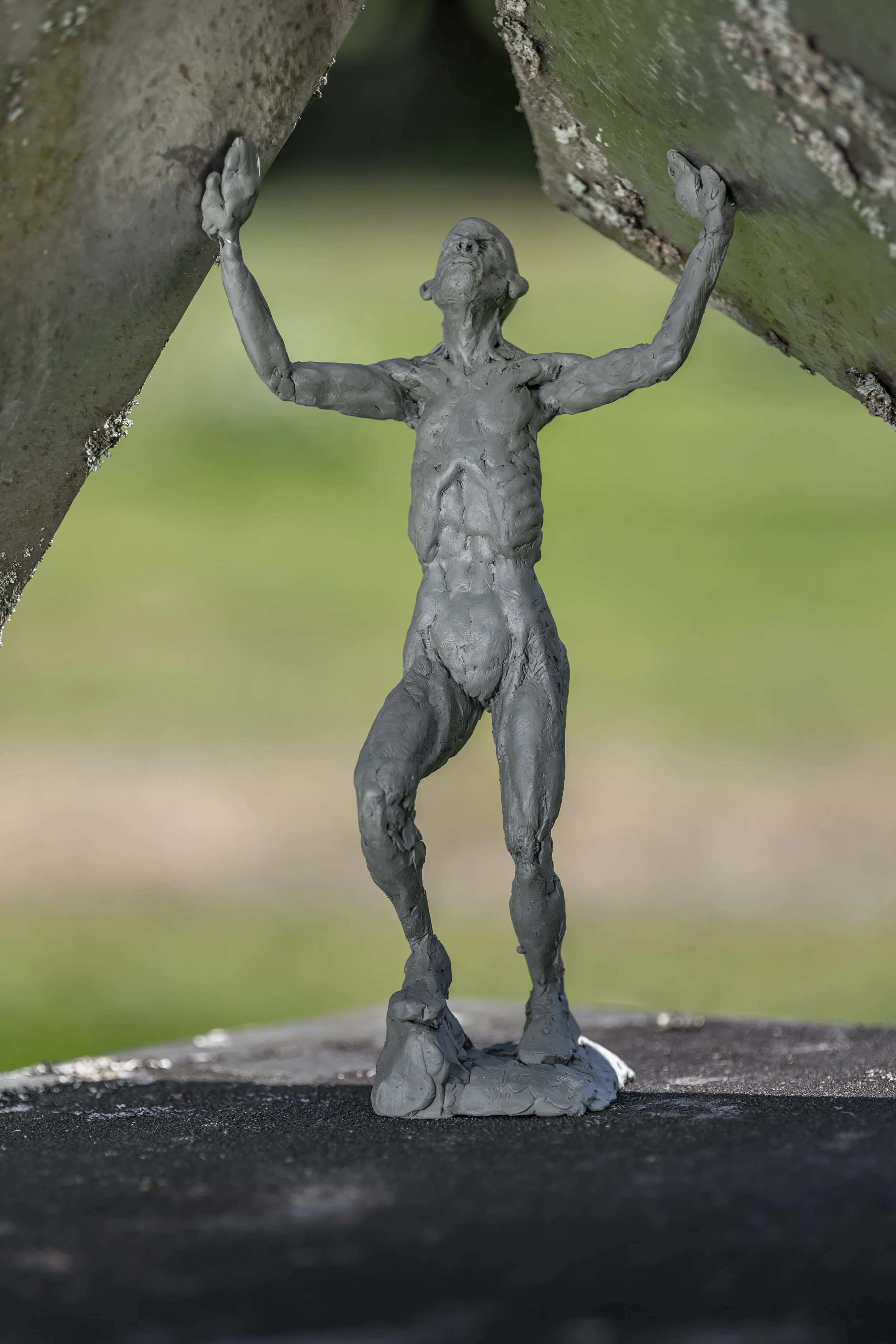 Clay figure on steel sculpture