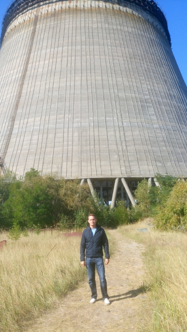 Standing in front of partially-constructed Cooling Tower #5 abandoned overnight after the Chernobyl nuclear disaster in 1986