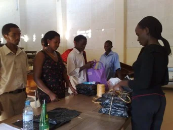 Students Going into the field receive copies of questionnaires. 