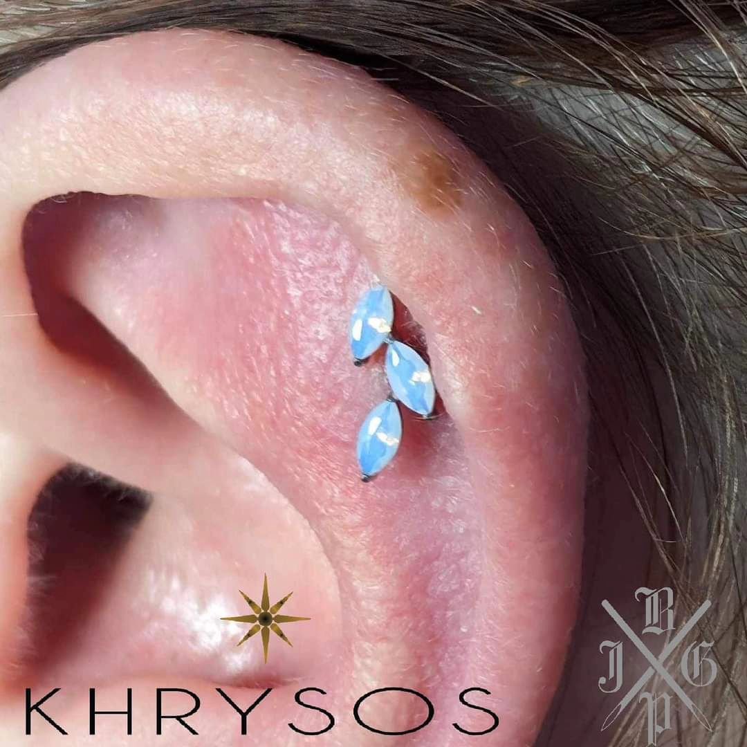 We are loving the look of this opalite top from @khrysospiercingjewelry installed for a customer by our piercer, Jack @piercings.jpg ! Several other options in stock today come see us!!! 😊

#cincinnatipiercer #professionalpiercer #implantgradetitani