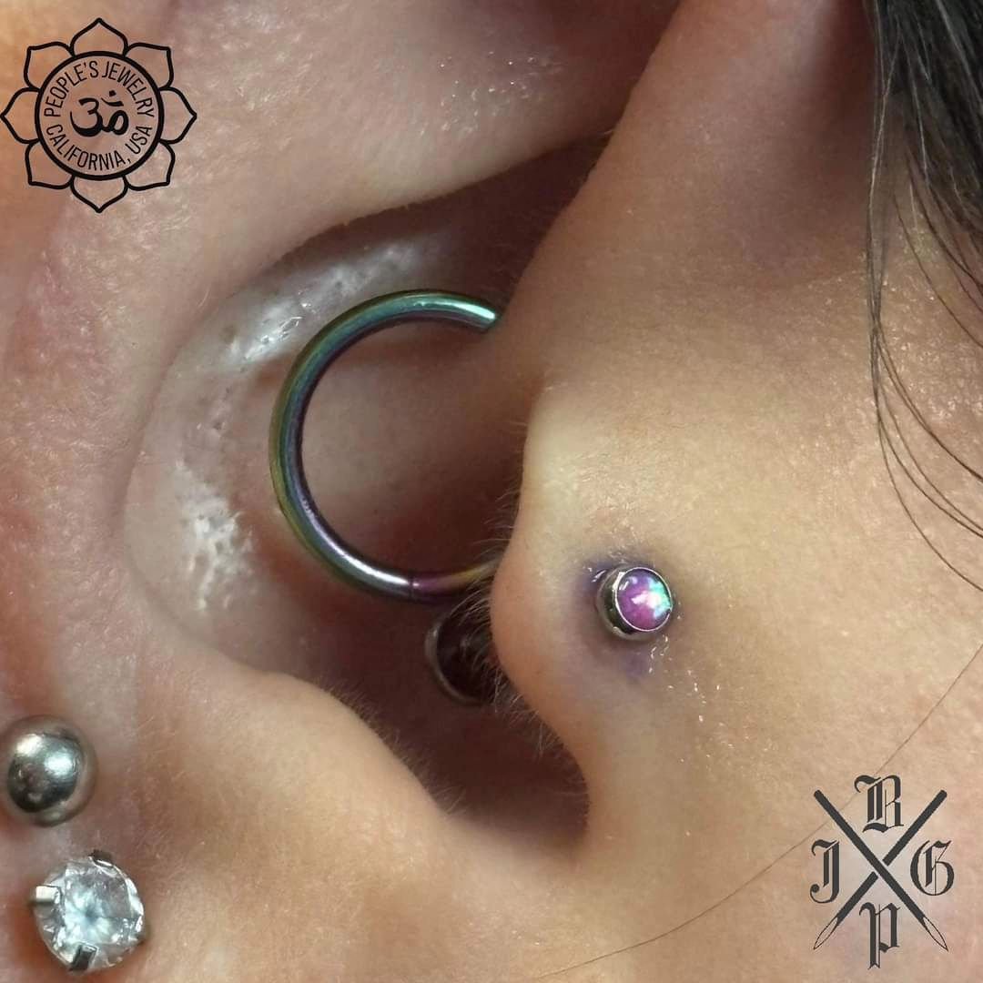 Appreciation post from our piercer, Jack:
&quot;Today, I had the absolute pleasure of using this beautiful magenta opal top from @peoples_jewelry on this fresh tragus piercing. The client was a actually a nurse who helped take care of my niece years 