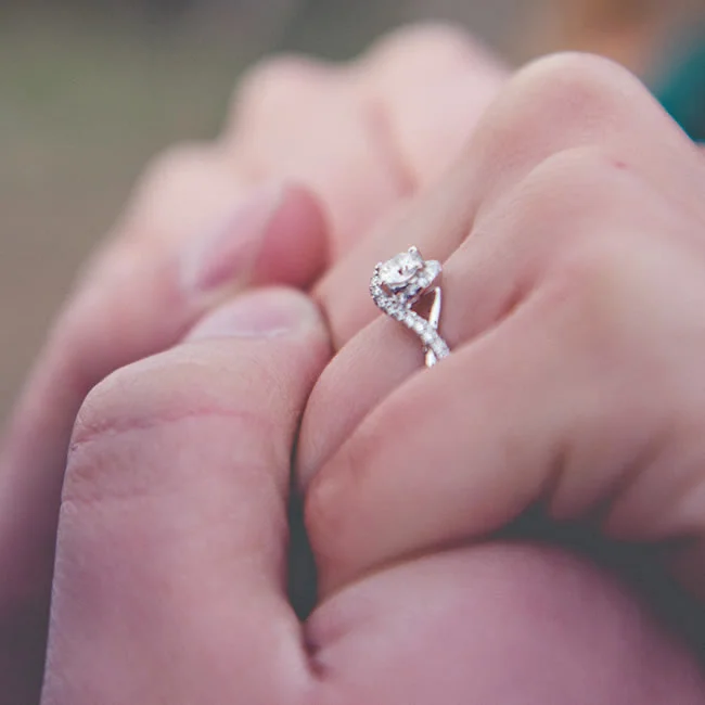 Tabatha's engagement ring is a white gold 14k ring, with a round cut diamond,
