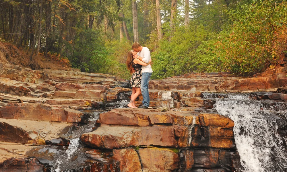 Denielle Maillot and Nick Grady share a moment close to home at Marysville Falls. —Photo by Cassidy Shankowsky, Cranbrook Photo .