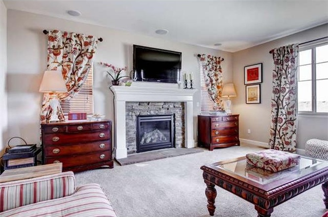 BTW: They must have photoshopped the heck out of that fireplace because it was never gray like that. I would have loved it if it was.