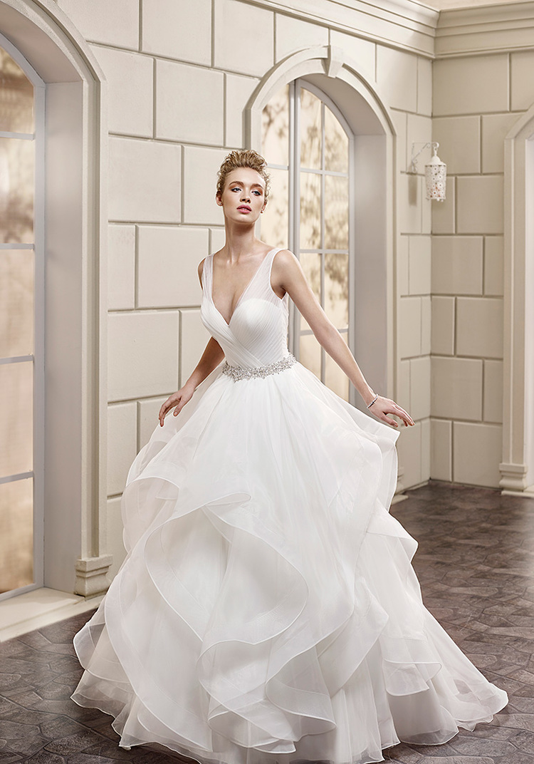 From Eddy K.'s Milano Collection, style AK150 is a sexy, yet classically styled ball gown wedding dress whose plunging neckline, though front and centered, is not the only star of the show!