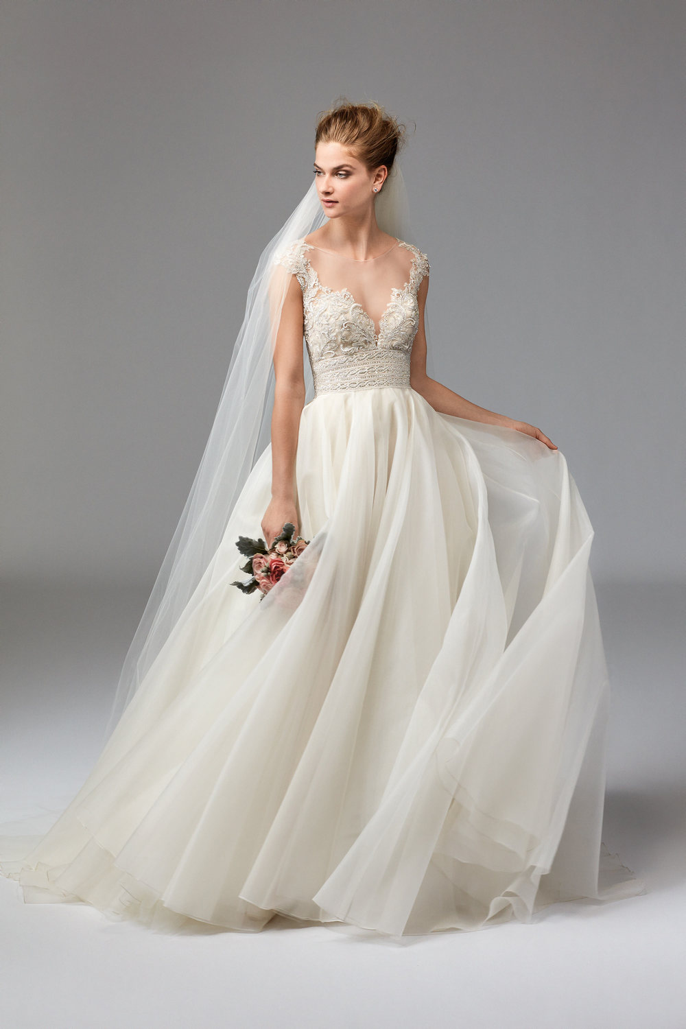 Azalea from Watters, accentuates her deep V-neckline with organza, crystals and pearls- making her one classy, hot mama!