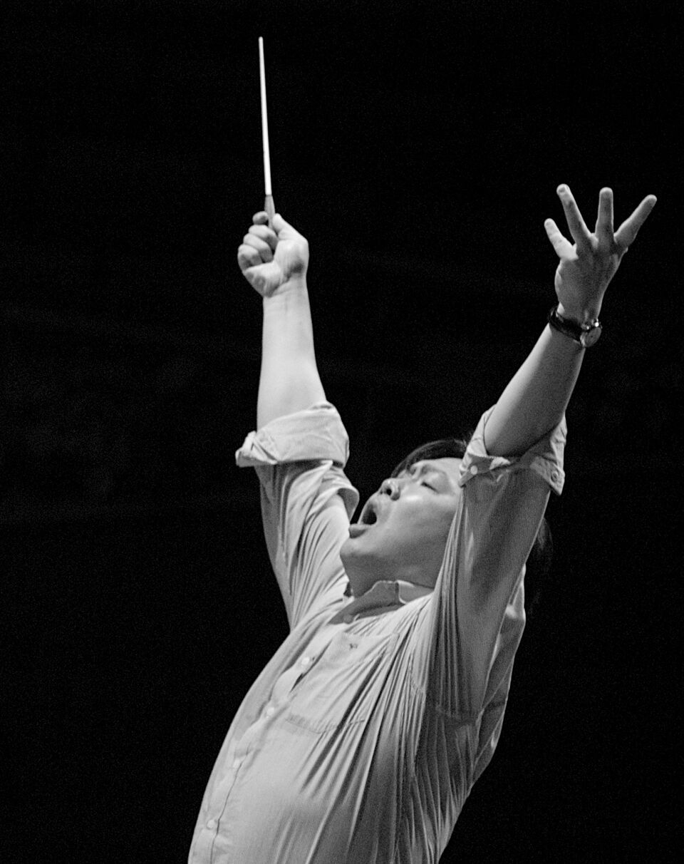 Long Yu passionately conducting