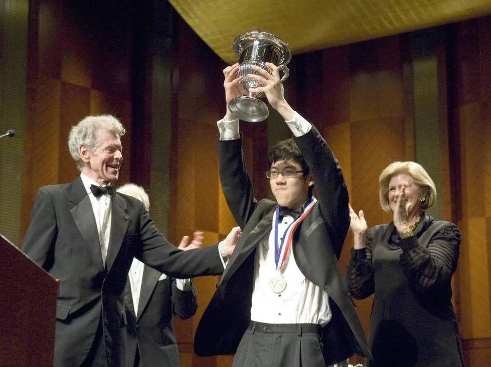 Van Cliburn, left, joins Haochen Zhang’s victory celebration in this 2009 photo. Credit: Anonymous, AP archives