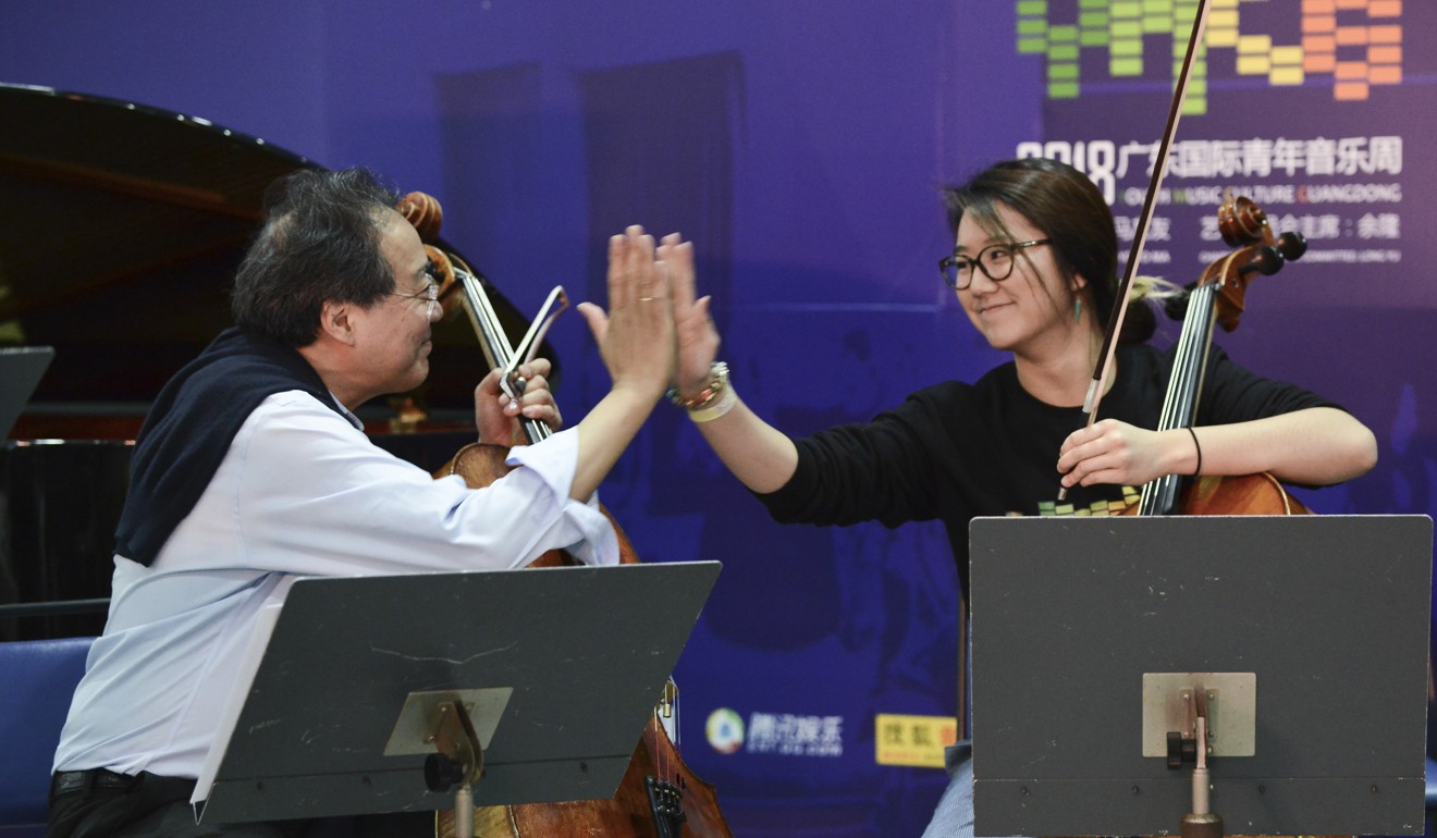 Yo-Yo Ma and Australian-Chinese cellist Rachel Siu high-five. Photo: Xiaomei Chen