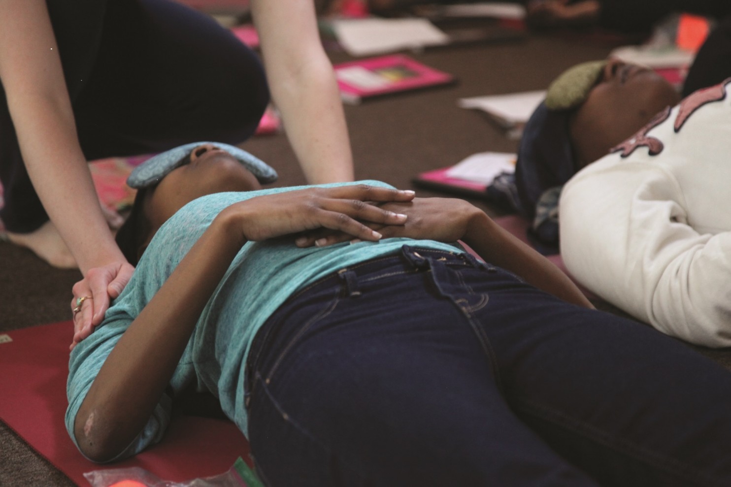 Young mothers at Youth Service in Philadelphia learned yoga while they were incarcerated as part of a pilot study by the Georgetown Law Center on poverty and inequality. (Rebecca Epstein)
