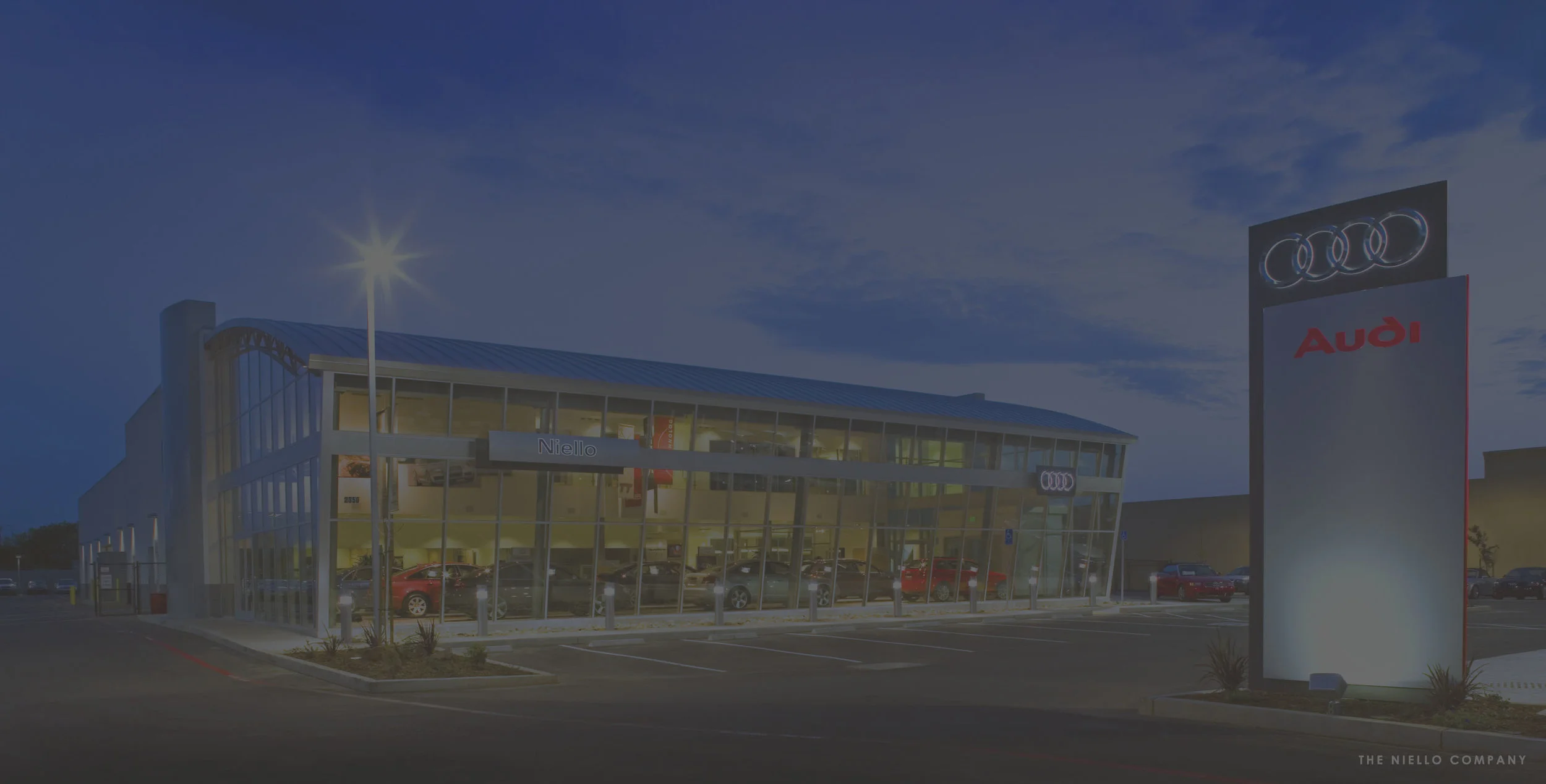 The design concept for a new Audi facility in Sacramento, California evolved from the high quality and high performance synonymous with the Audi brand. This 35,000 sq. ft. facility includes a hangar style showroom, a customer service lounge, second floor administrative offices, the Quattro Cafe, retail parts storage and a service shop containing 25 work stalls and three wash bays.