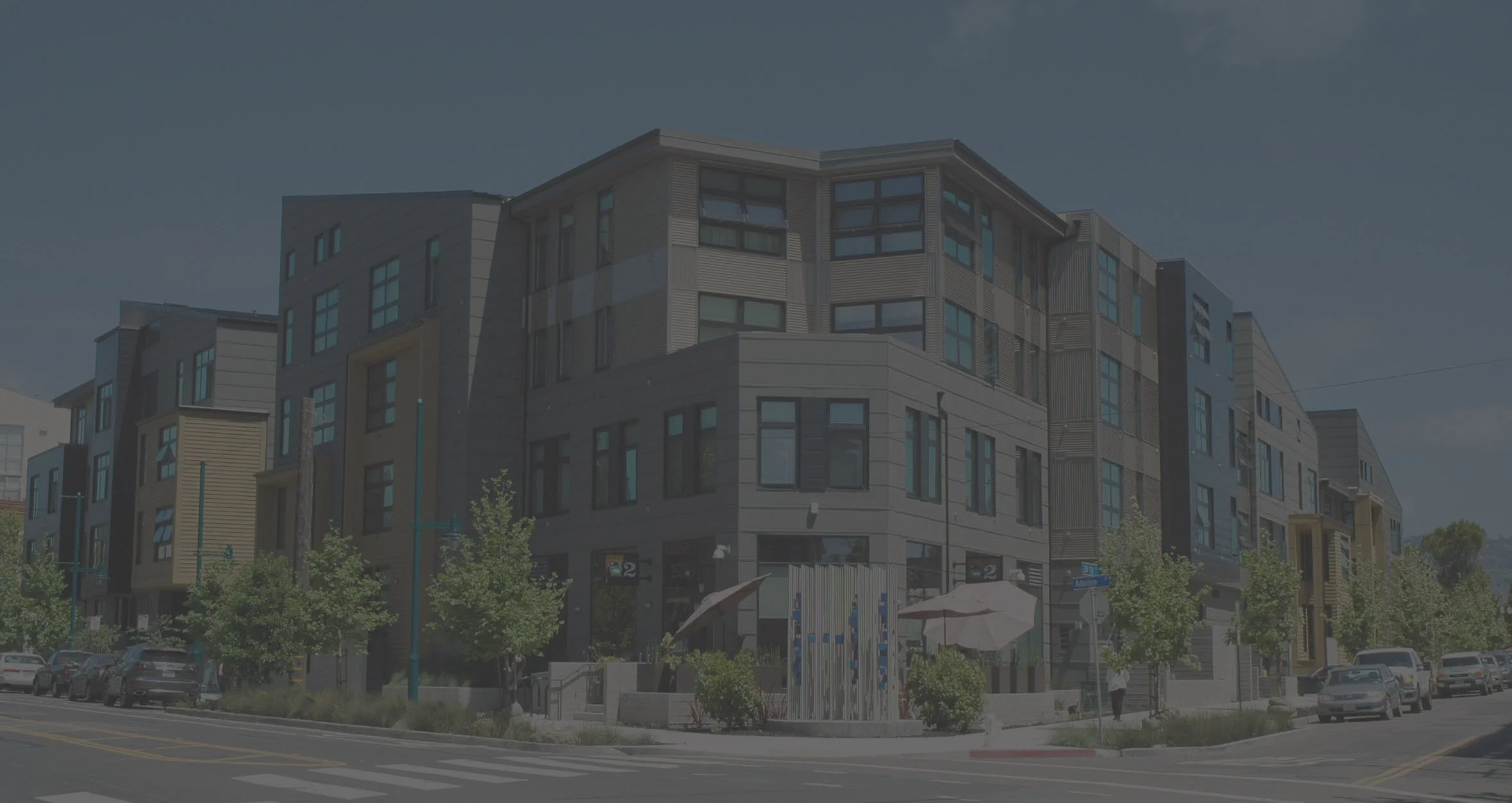 3900 Adeline is an infill mixed use development located on the Oakland/Emeryville border. This project incorporates 91 residential (1, 2 and 3 bedrooms), 10 live/work and 13 affordable units over ground level parking on a 1.1 acre site. This sustainable design follows the Alameda County Multifamily Green Building Guidelines as well as incorporating a retail component with accompanying outdoor seating terrace. The residential units and retail space are divided up into 4 separate buildings, each connected by bridges surrounding a central communal courtyard. The project’s exterior responds to the surrounding context, with a sensitivity to scale of neighboring structures.
