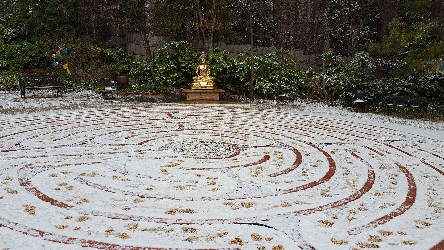 Snow on the labyrinth. Buddha is in place and just needs a temple.