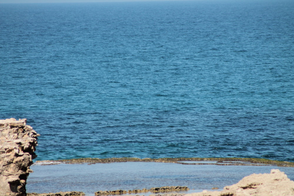 Looking at the Mediterranean over the freshwater pool constructed by Herod the Great before the birth of Jesus.