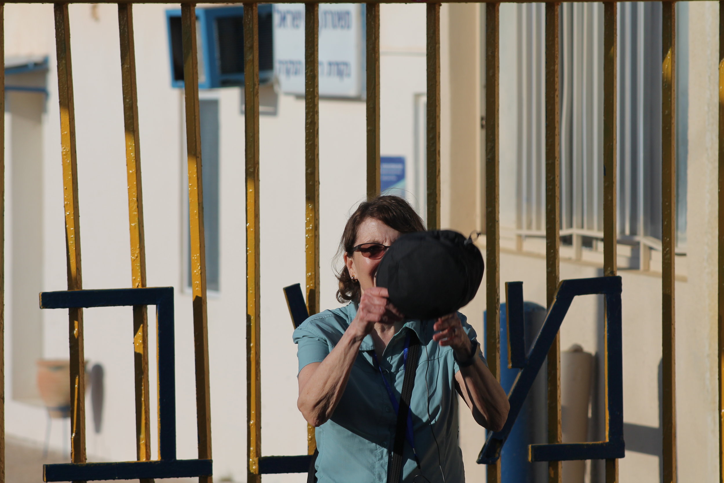 Marcia looking back from the Lebanon border checkpoint where she got a photo with the guard.