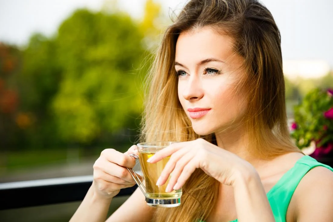 woman-outside-drinking-green-herbal-tea.jpg