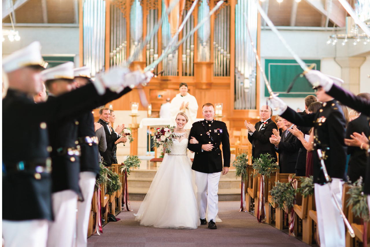 Marine Corps wedding tradition, the bride and groom exiting under a sword arch!