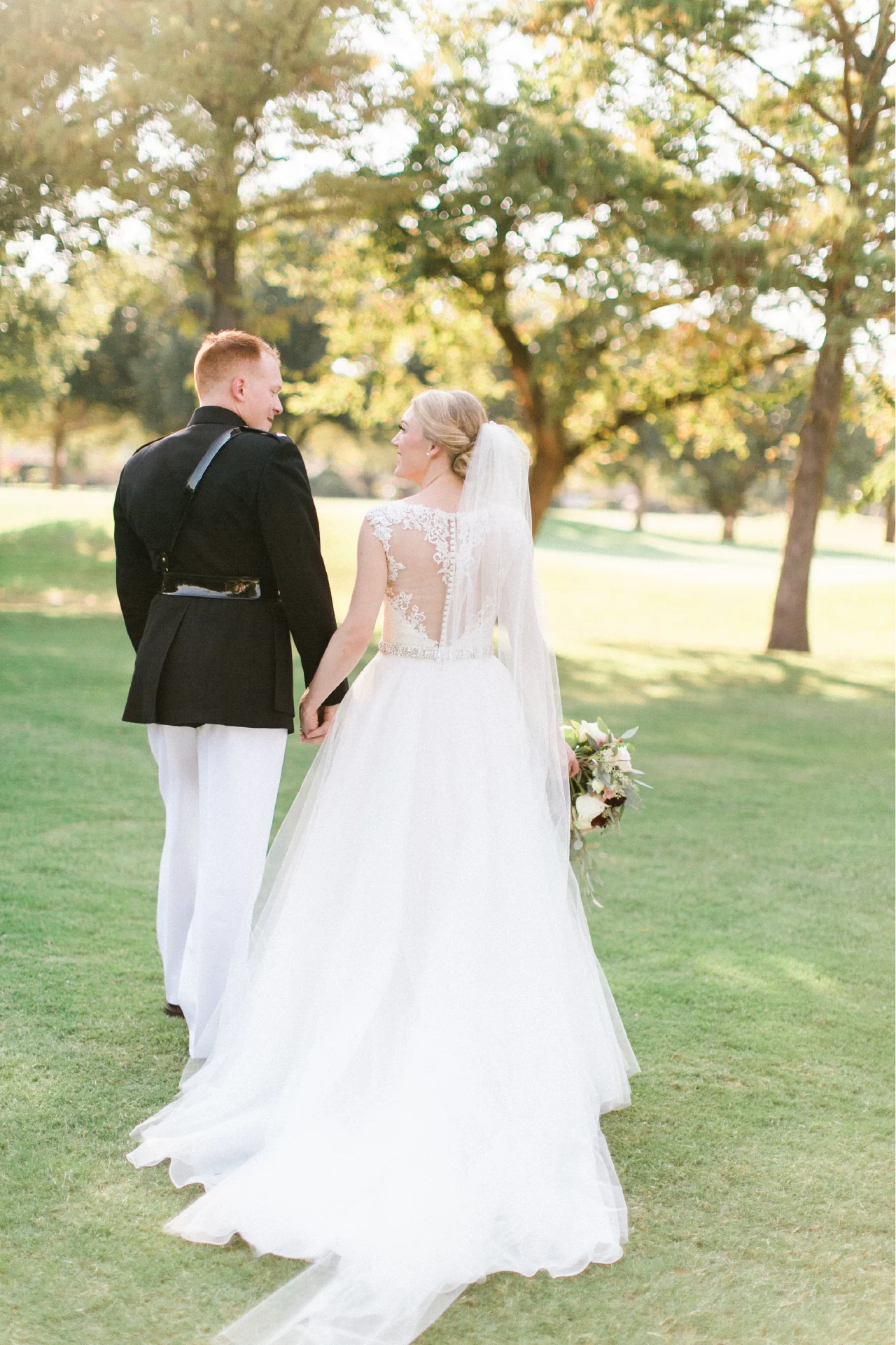 Full tulle skirt wedding gown with lace embroidery details on the bust.