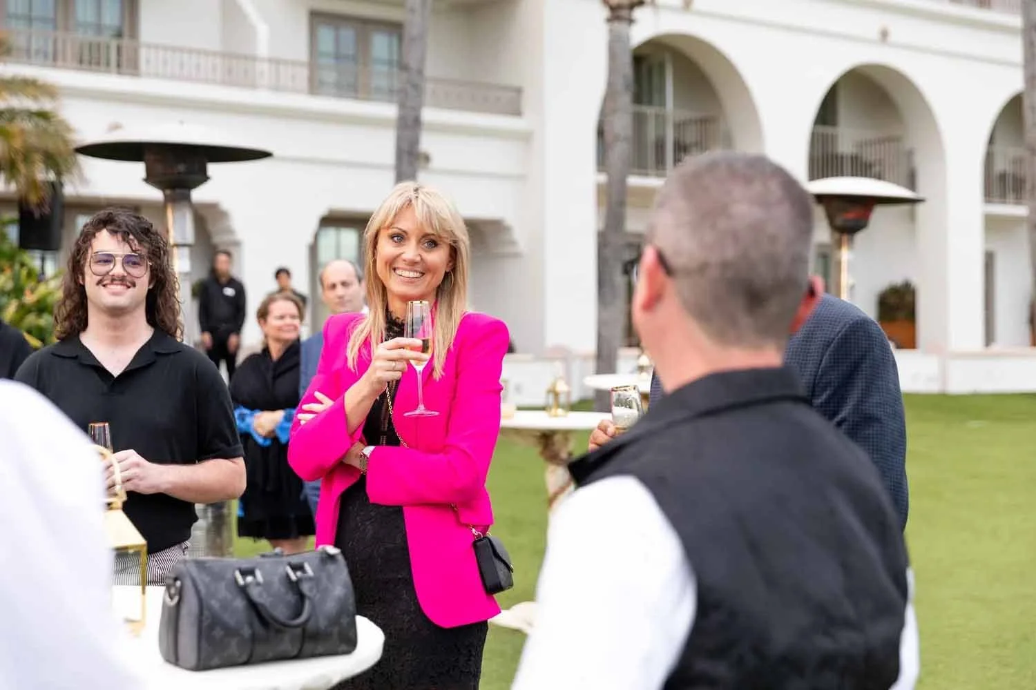 Guests enjoying cocktails during a sunset happy hour at the 180blu oceanfront lounge at The Ritz-Carlton, Laguna Niguel.