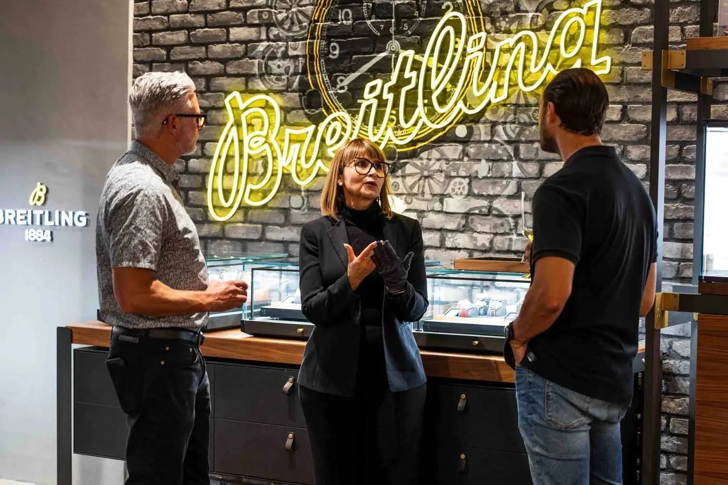 A Breitling brand representative discussing luxury watch options with a client during a private showcase in Los Angeles.