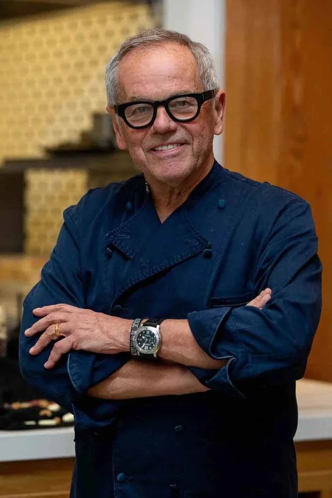 Posed portrait of celebrity chef Wolfgang Puck in the dining room of his flagship restaurant, Spago Beverly Hills.