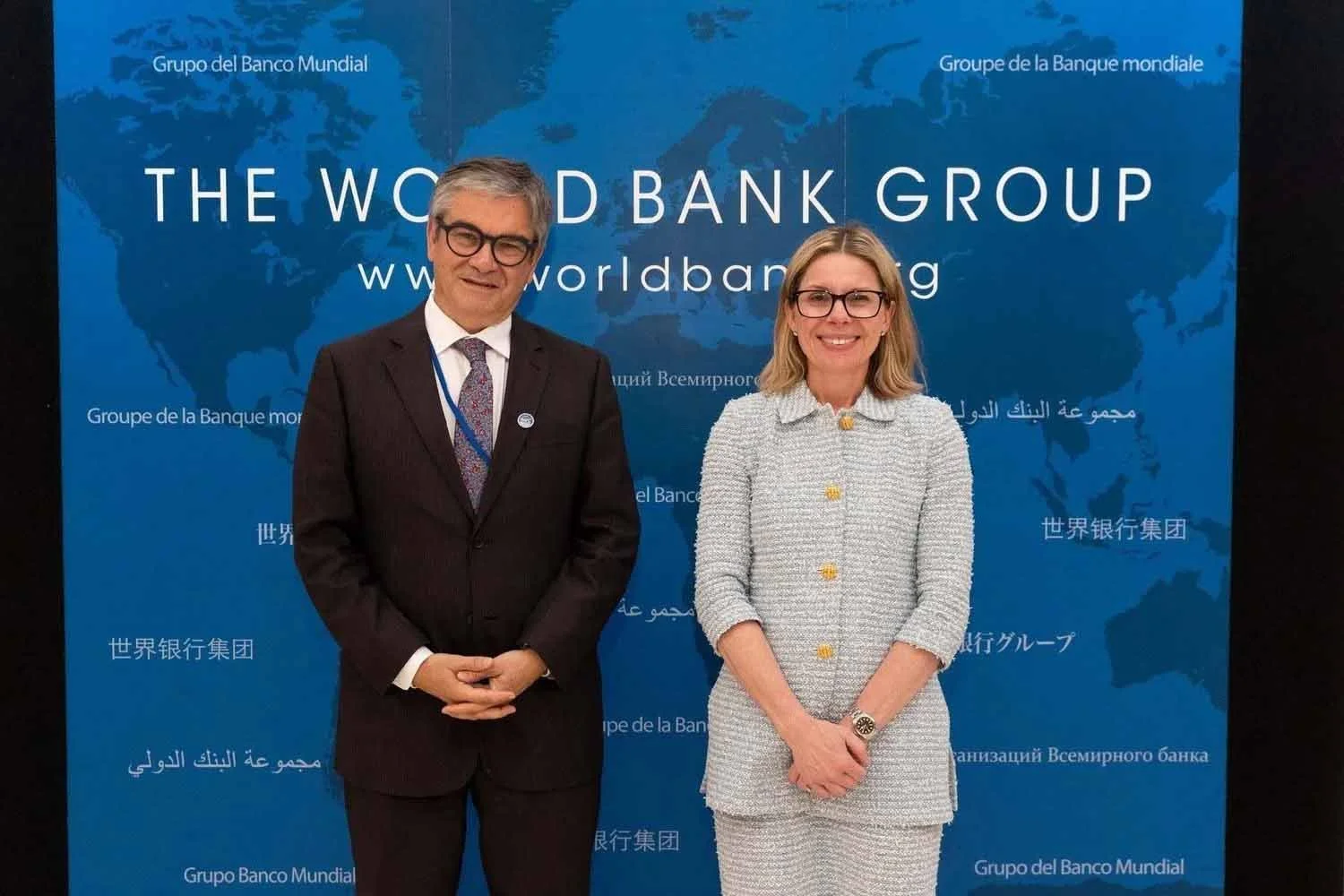 A delegate posing with World Bank Managing Director of Operations Anna Bjerde at a global development summit in Los Angeles.