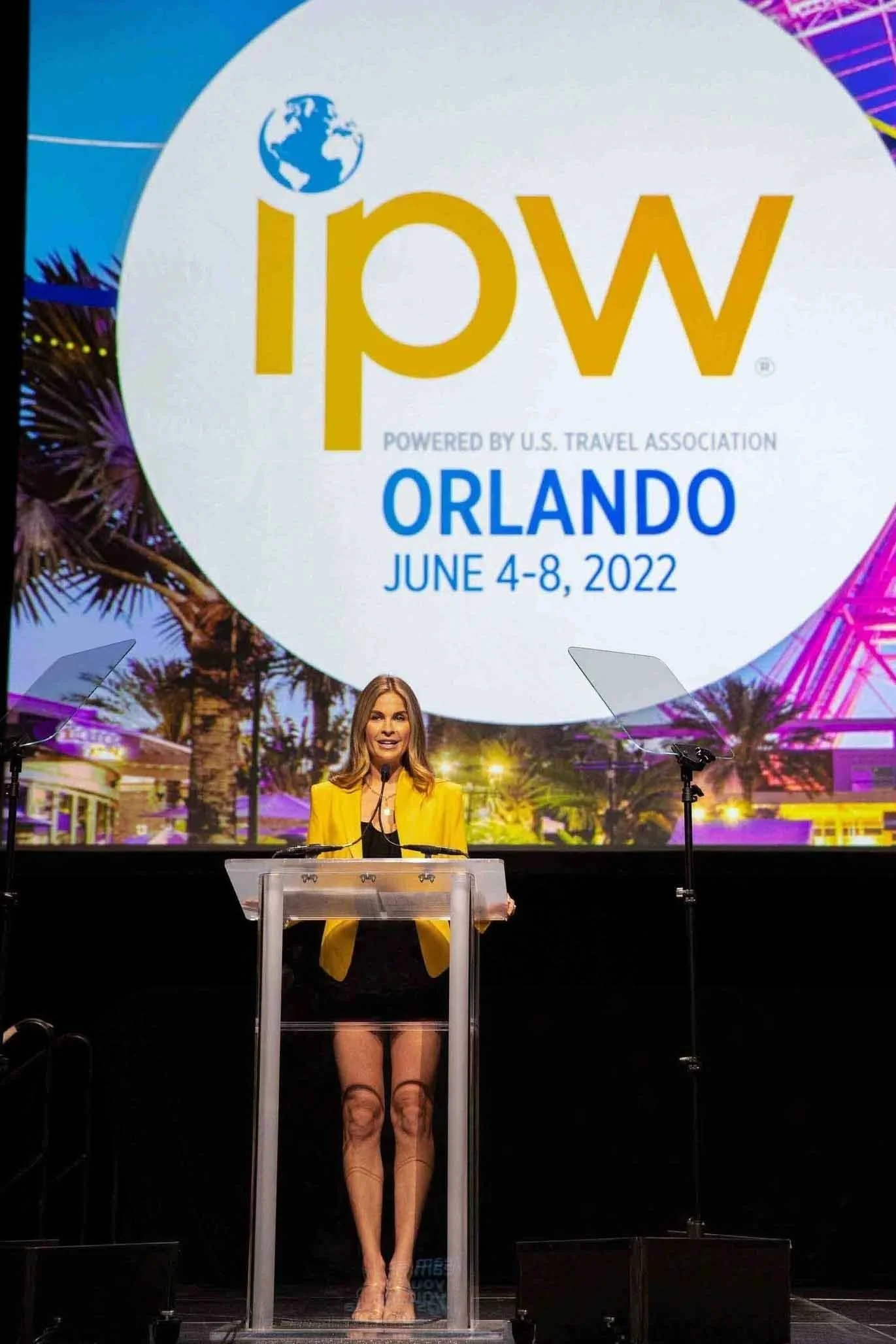 Keynote speaker announcing Orlando as the next travel conference destination during a session at the Los Angeles Convention Center.