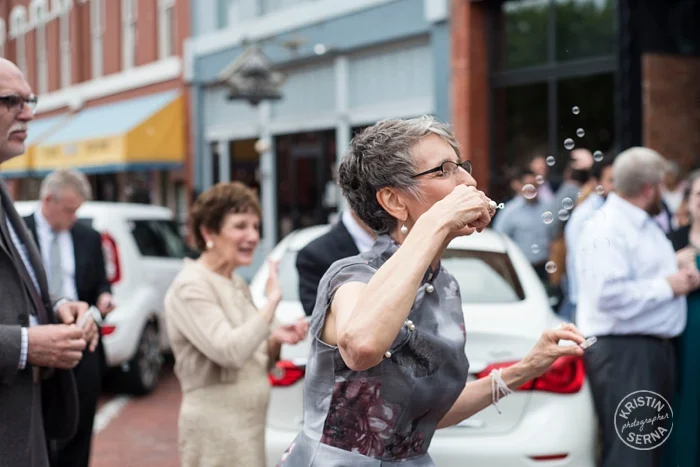 Mom Blowing Bubbles at Wedding. 