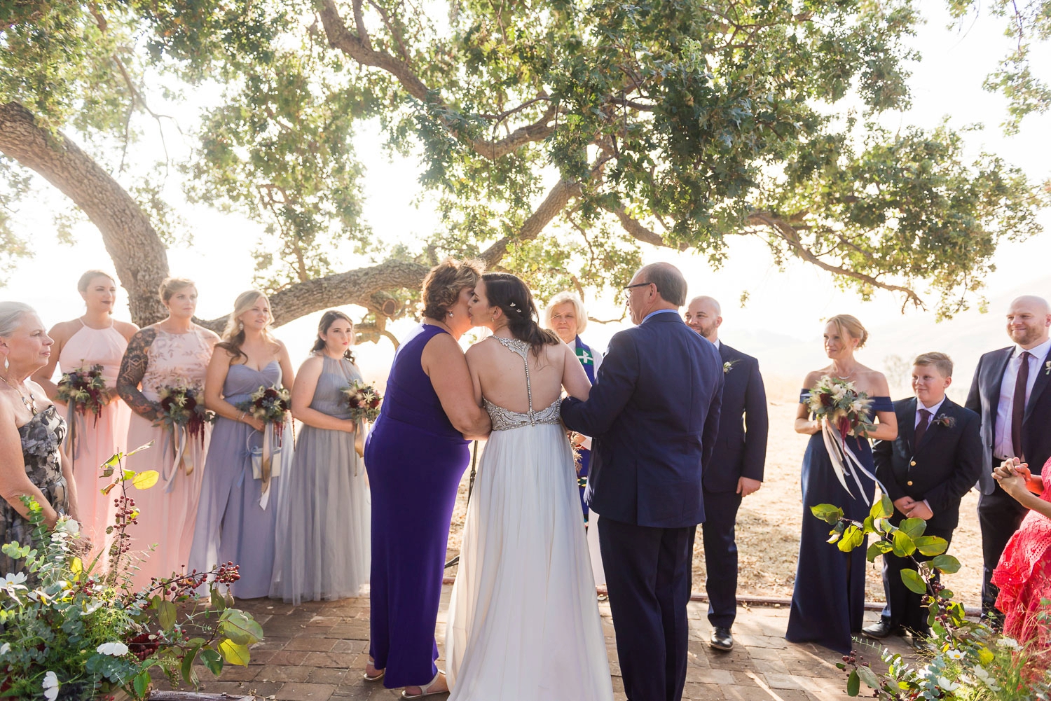 Bride with parents at altar