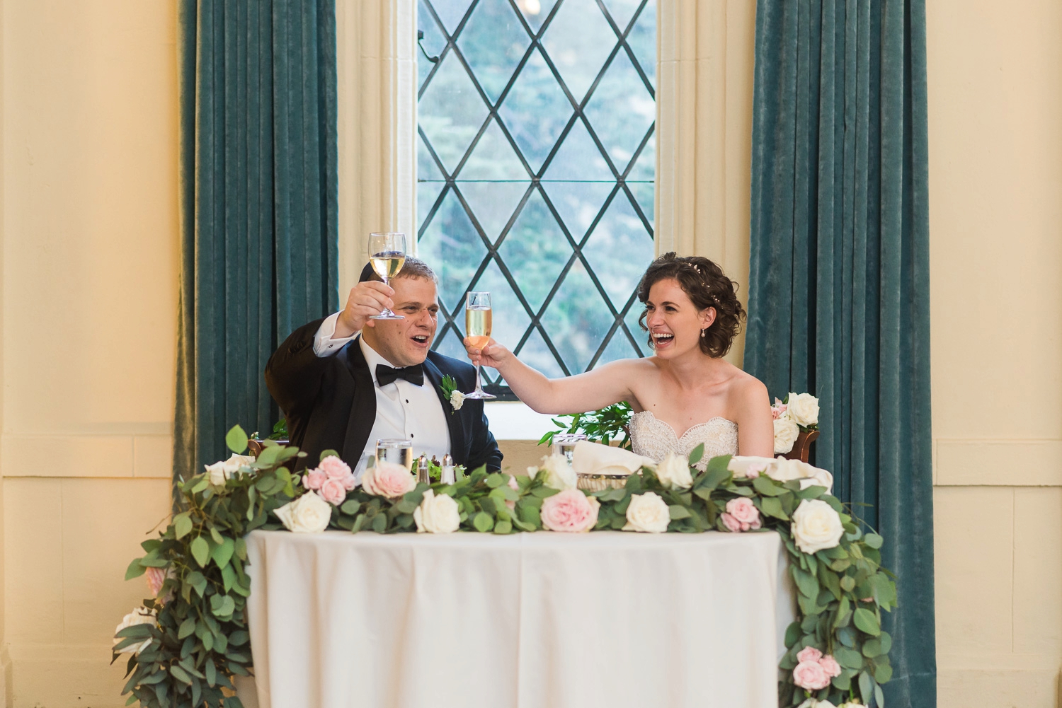 Bride and groom toasting with champagne