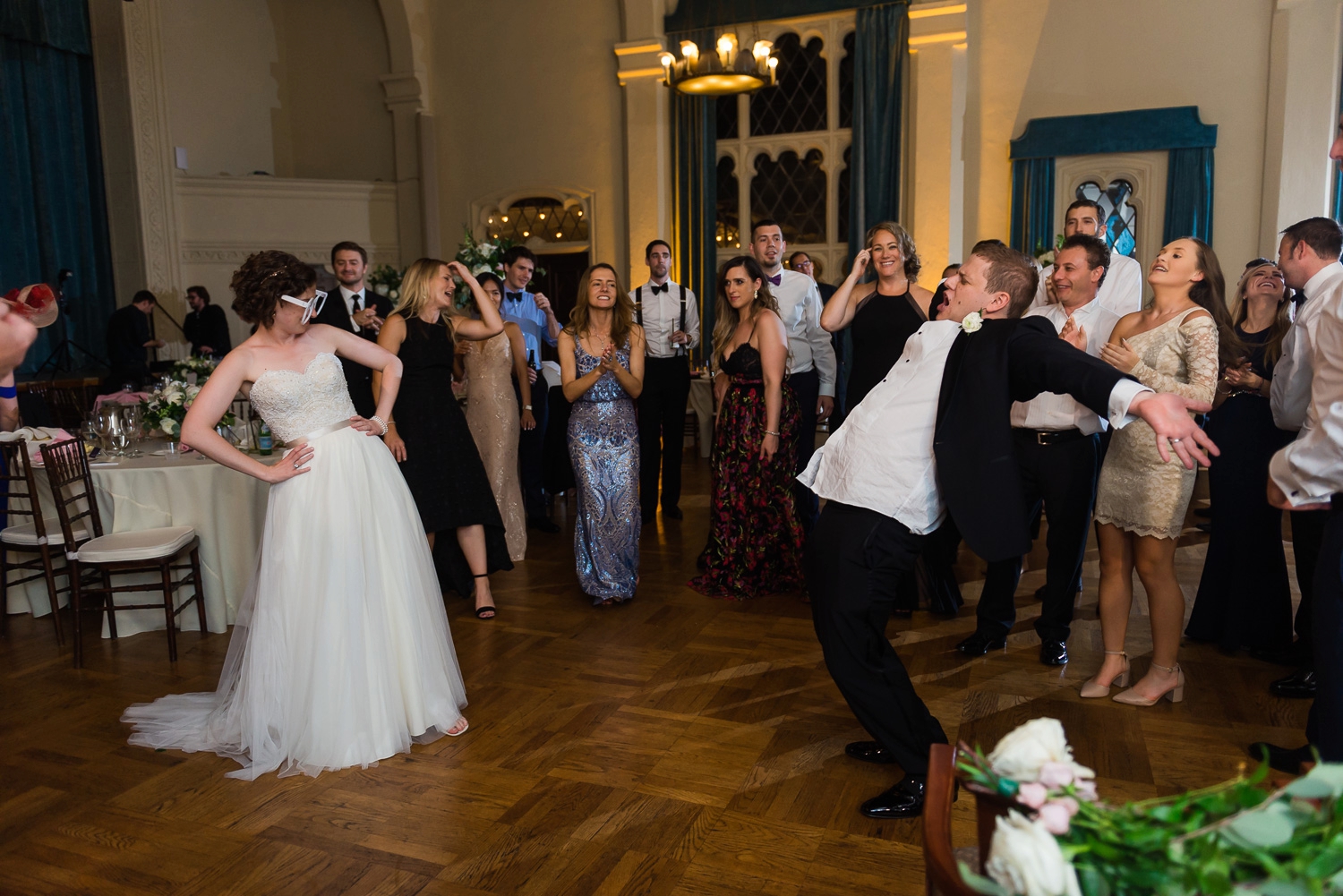 Bride and groom dancing silly