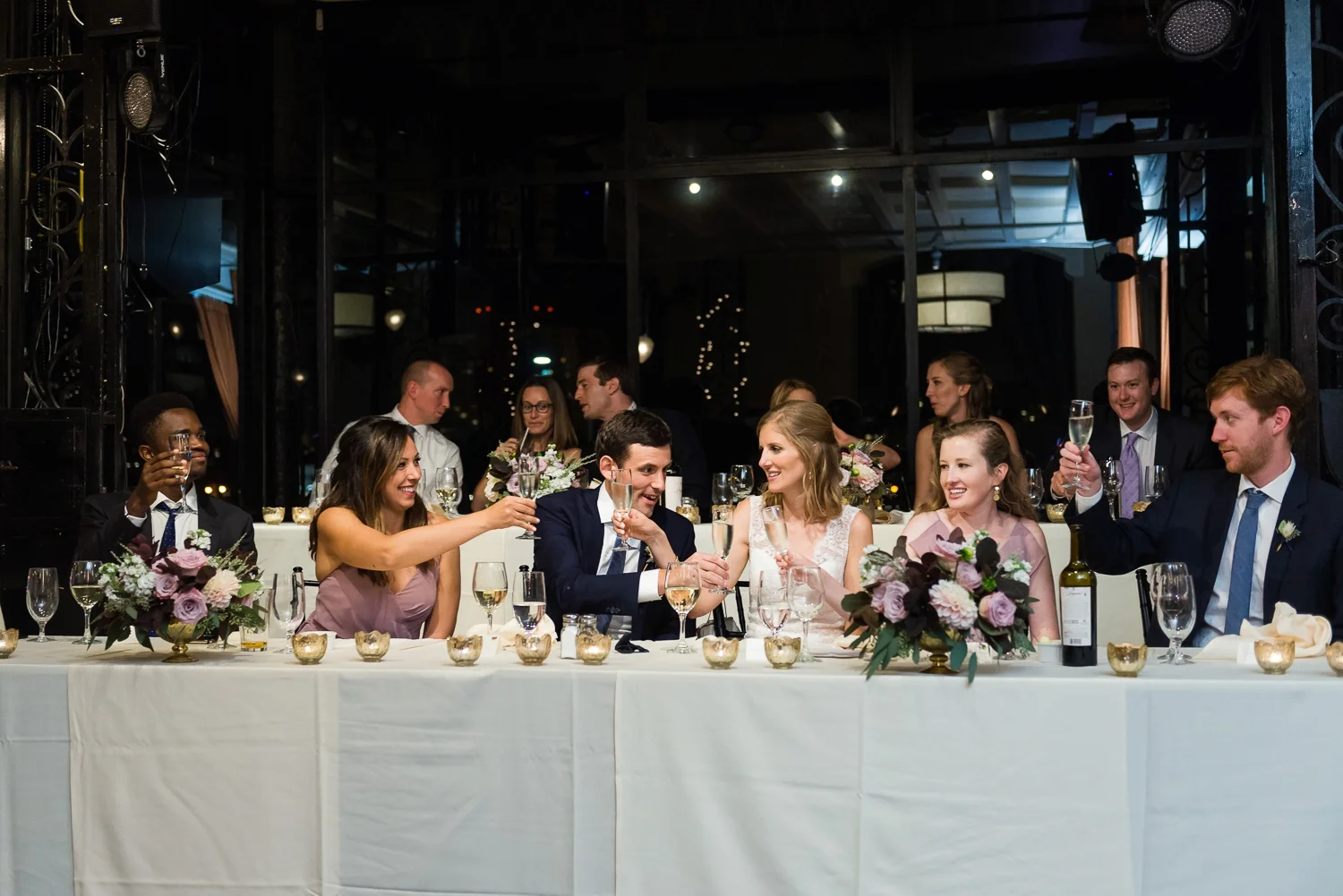 Wedding couple and wedding part toasting champagne