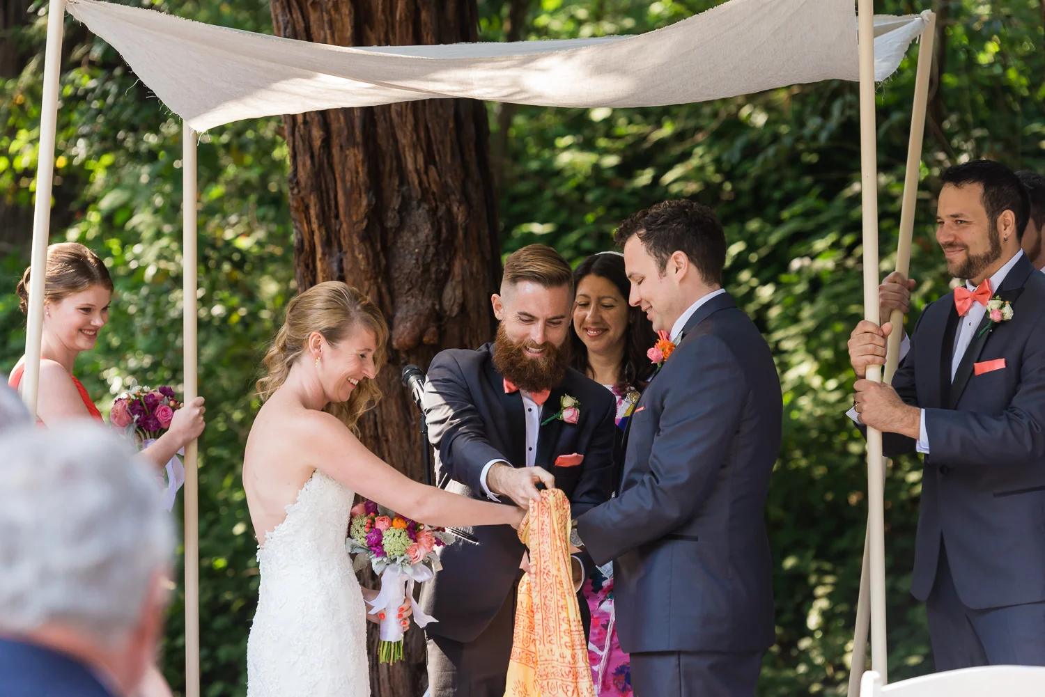 Bride and groom under a chuppah