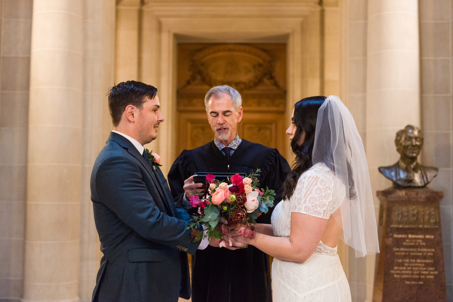 Bride and groom at San Francisco City Hall rotunda