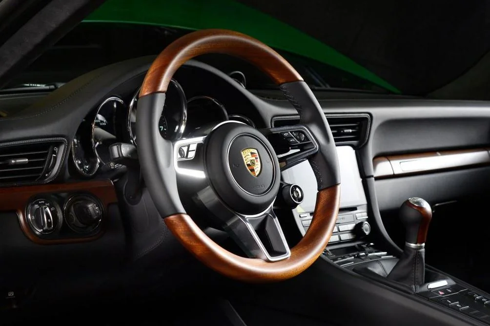 The Porsche crest, proudly placed on the steering wheel as well as the bonnet
