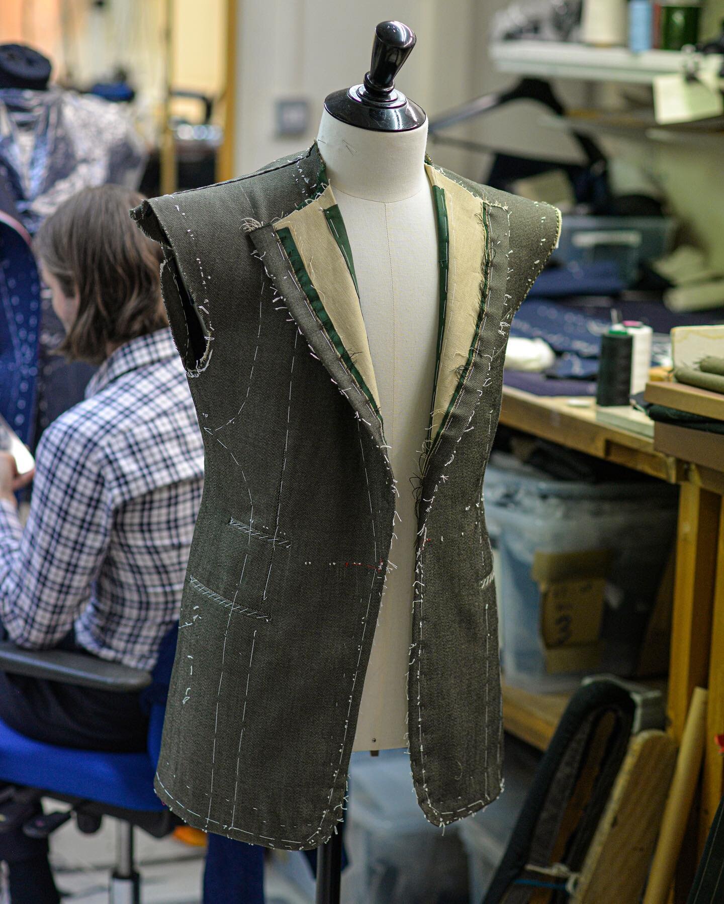 A pocket baste being put together in our workshop at 12 Savile Row.

There are various stages of fittings, and we only progress to the next stage of construction once we are fully satisfied with everything on the garment . This jacket will soon becom