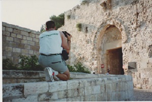 Phil Supple photographing Zion Gate in summer 1990. The bullet holes date to the war of 1948.