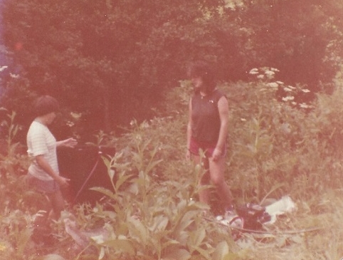 Alice, flotation machine, me - Castell Henllys, 1981, a short distance from farmhouse. The 'jungle' was cut away in subsequent years