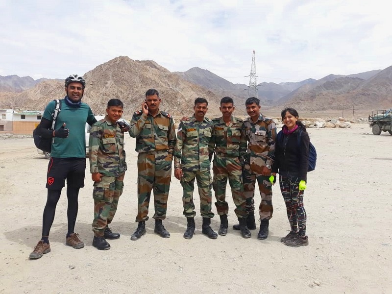 a photo opportunity with the hardworking army personnel in ladakh on our cycling break in india