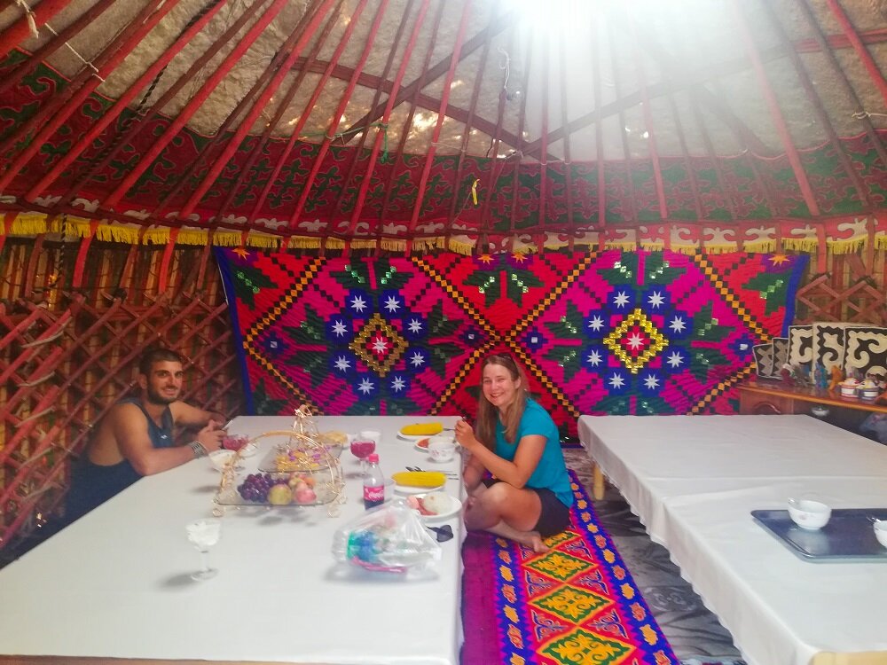 Roberto with Joanna at the Yurt dining table in Saikal Guest House