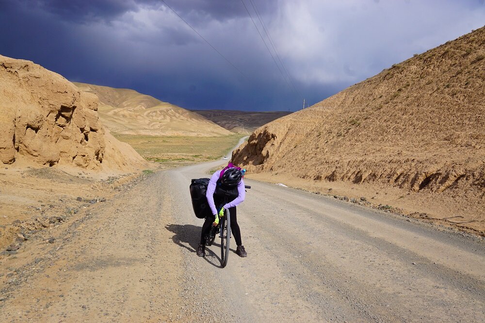 Obviously exhausted and never ashamed to admit defeat sometimes while cycling or bicycle touring in Kyrgyzstan. PC: Joanna