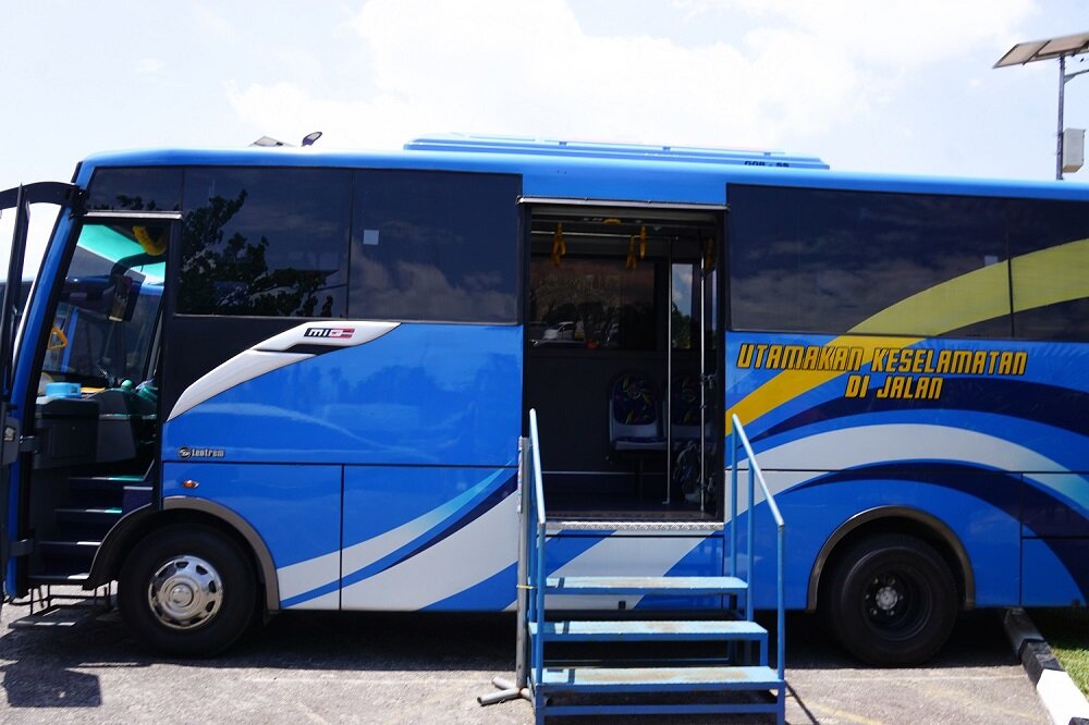 Catching the bus using Belitung’s free shuttle services at the airport to the island