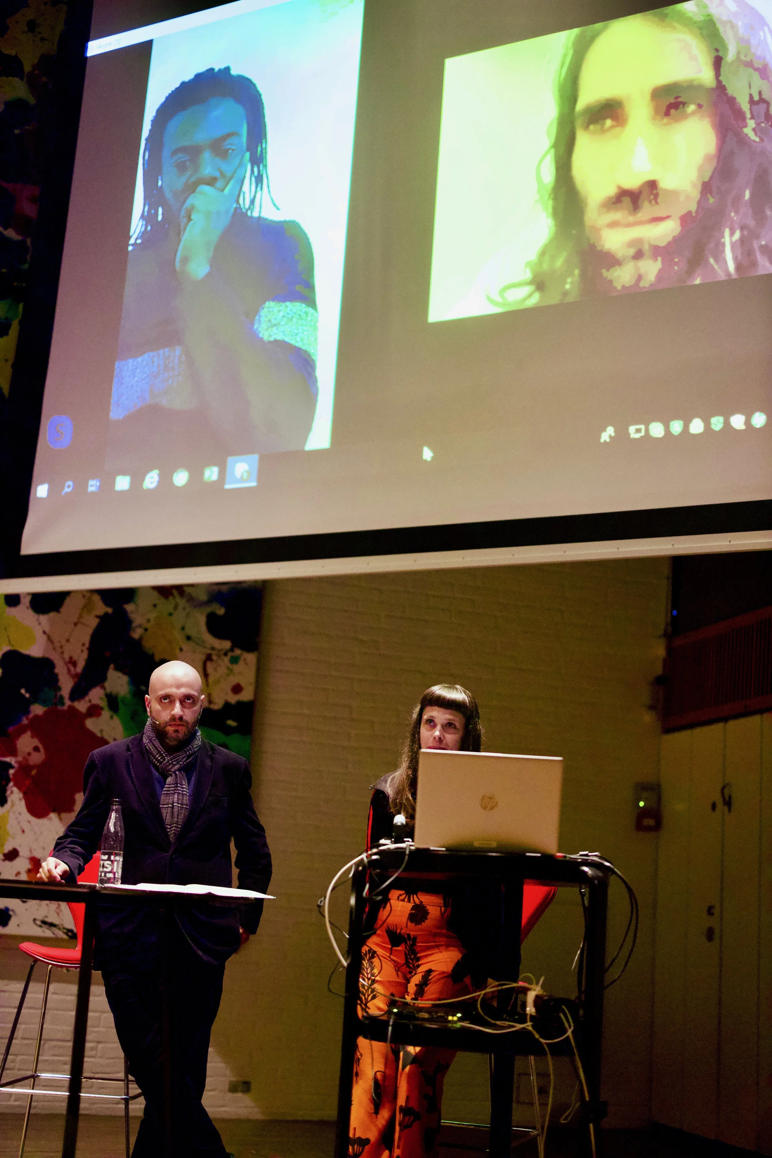 Screen - left: Stanley Edward, right: Behrouz Boochani. Floor - left: Arash Kamali Sarvestani, right: Liv Nimand Duvå