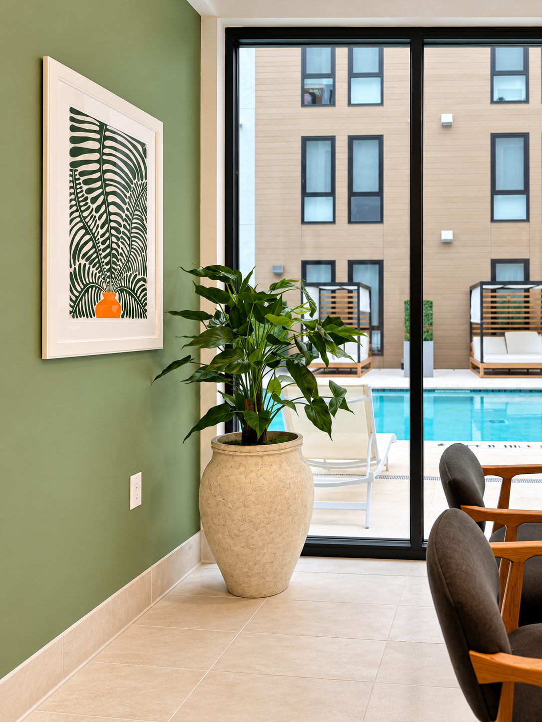 Sage Lounge Overlooking a Pool Courtyard.png